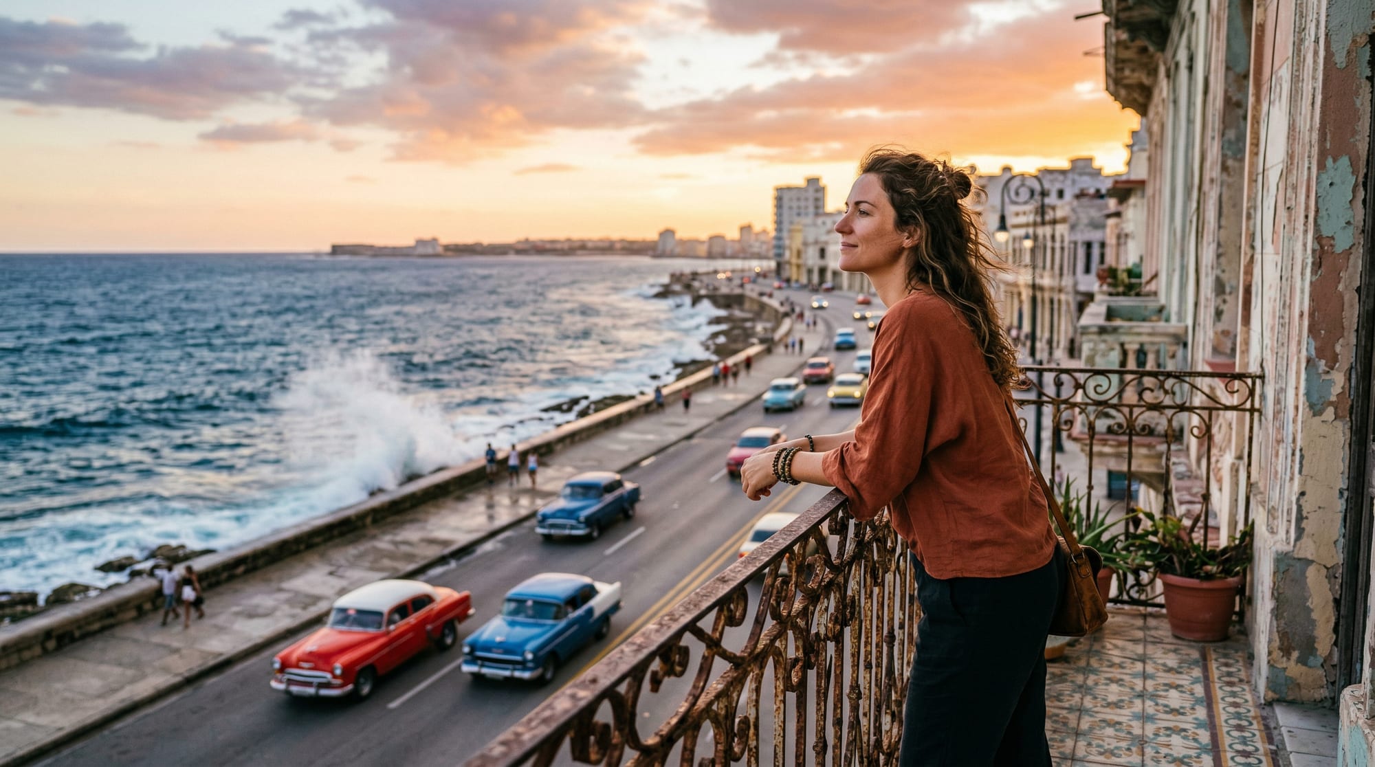 Traveller enjoying the view of Havana's Malecón seawall at sunset